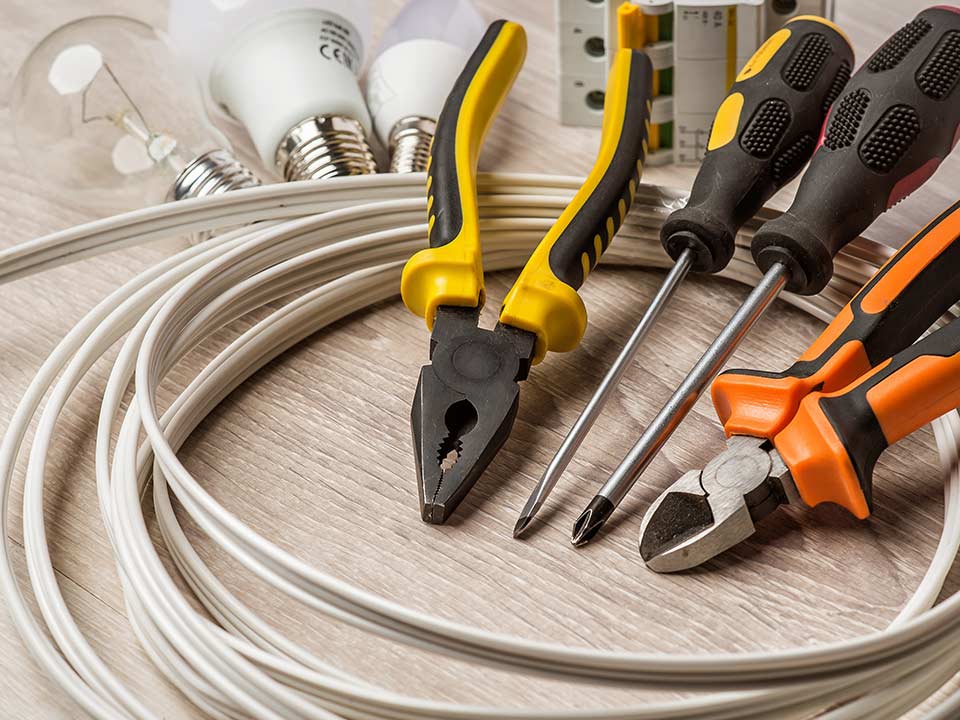 A group of tools sitting on top of a wooden table.