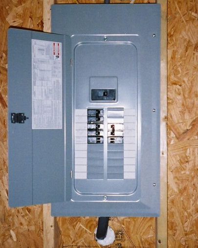 A view of an electrical panel with the cover open.